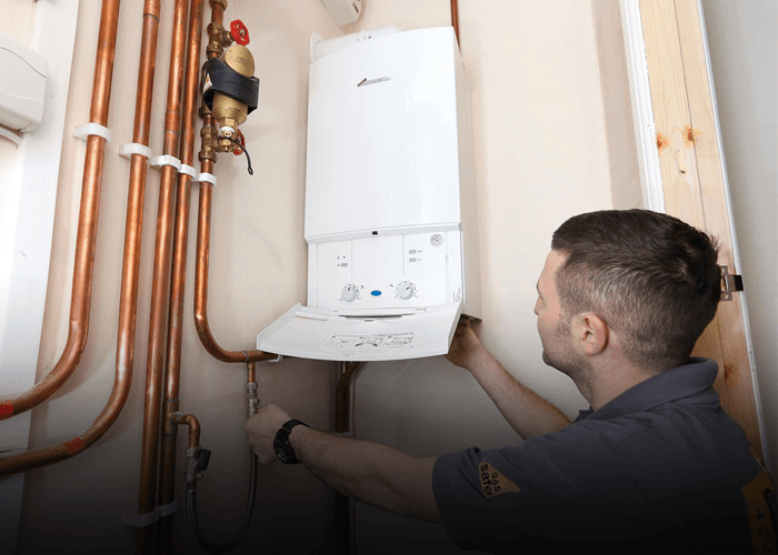 Professional engineer fitting a new boiler in Sheffield home